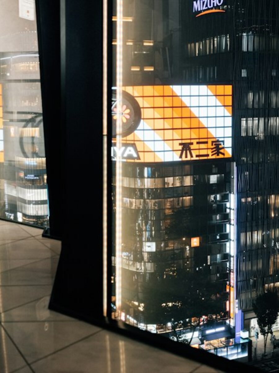 Modern building exterior with illuminated windows at night