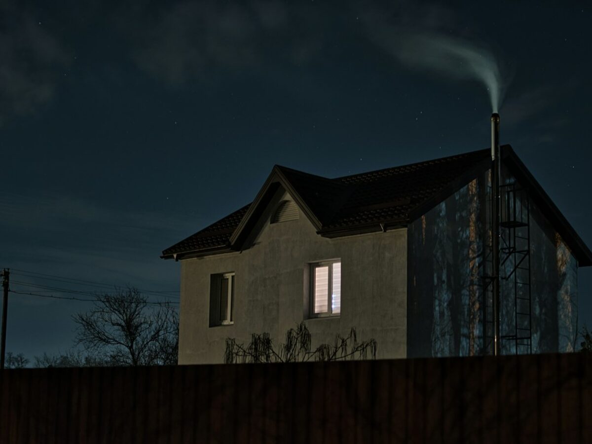 White and black home illuminated at night