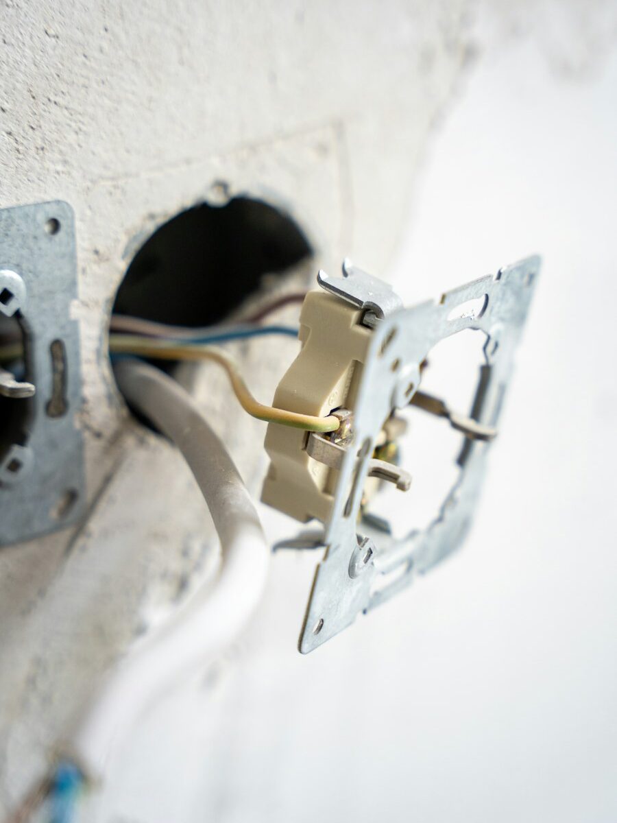 Exposed electrical wiring inside a wall